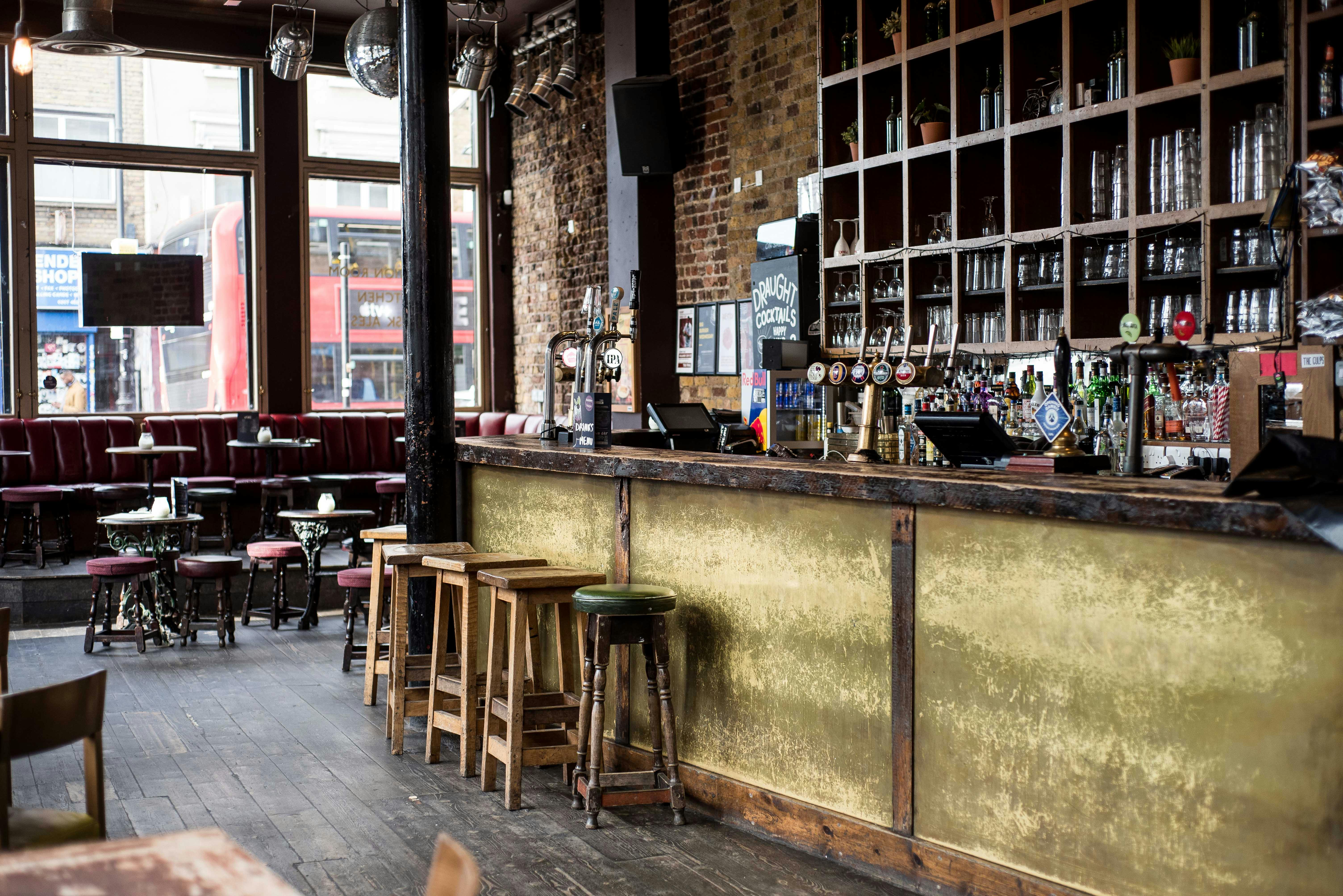 Stylish bar venue with exposed brick, ideal for networking events and informal meetings.