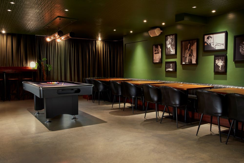 Stylish event space with pool table, ideal for networking and casual gatherings.