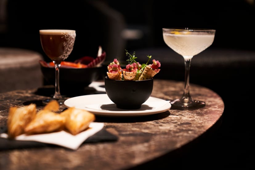 Elegant venue setup with gourmet appetizers for networking events in Nolita Social.