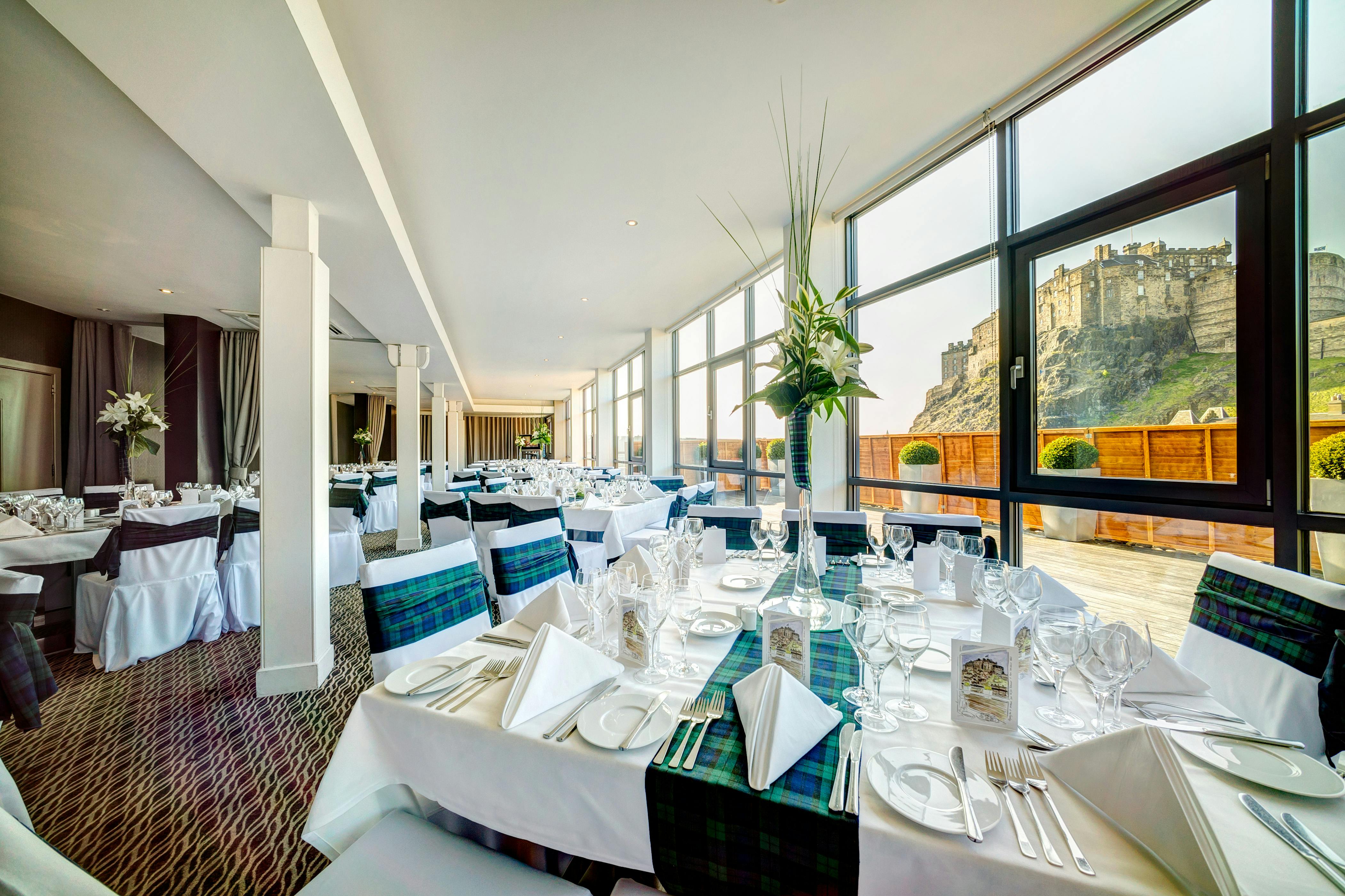 Elegant dining area at Apex Grassmarket Hotel with castle view, perfect for weddings and events.