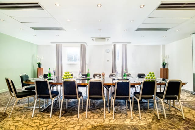 Meeting room at Apex Grassmarket Hotel, set for workshops with natural light and focus.