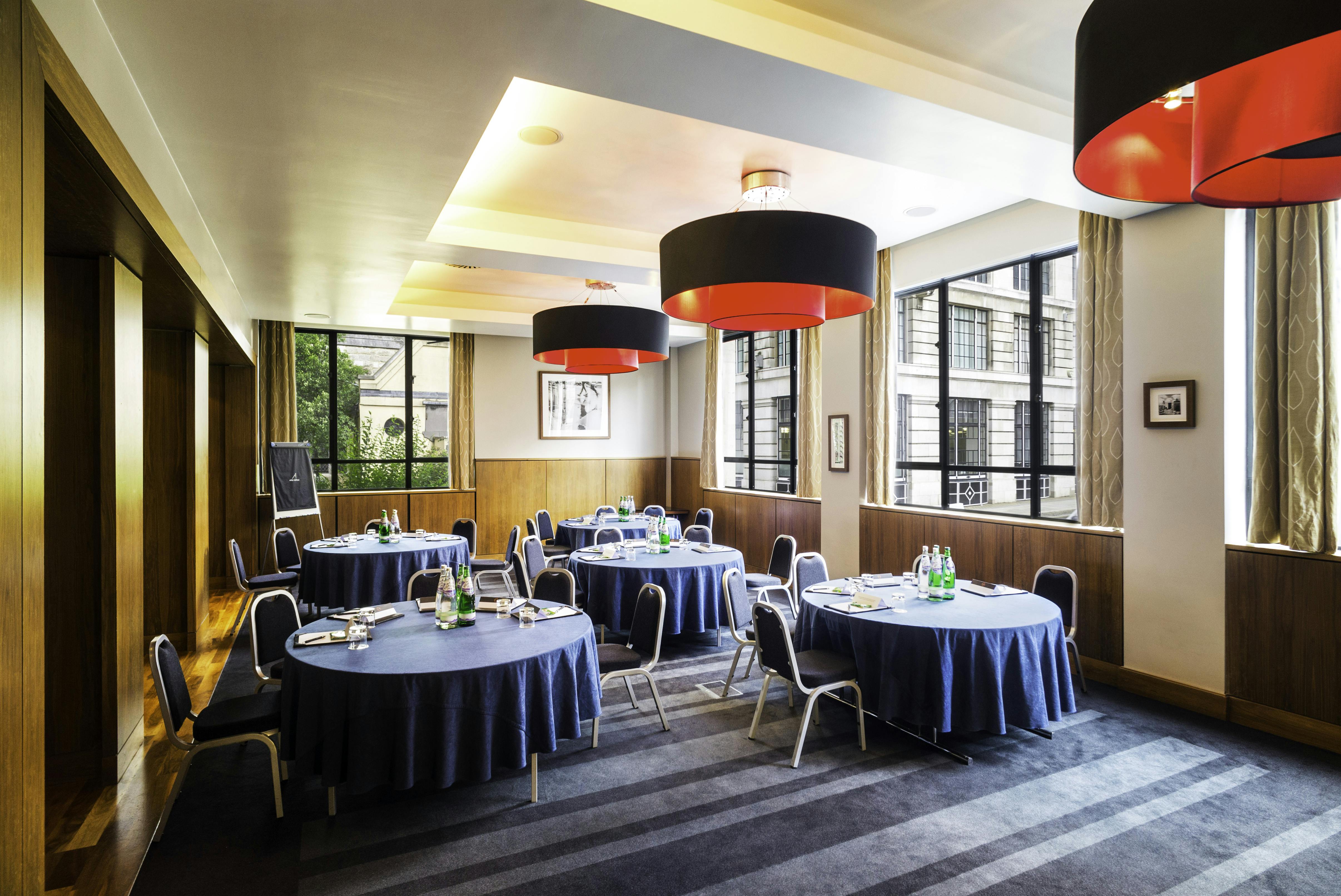 City Suite meeting room with navy tables, perfect for corporate events and workshops.