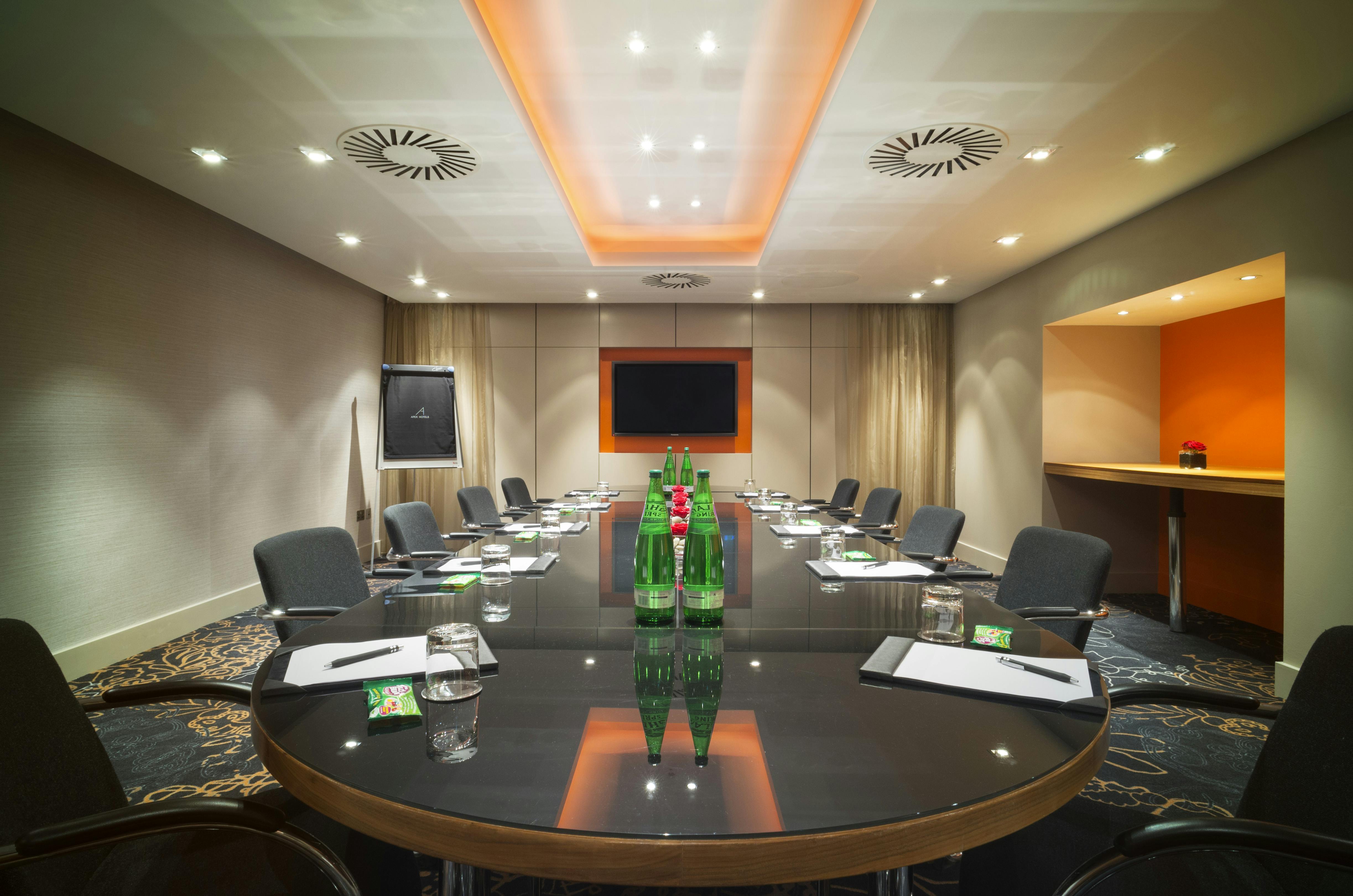 Modern meeting room in Apex City of London Hotel, ideal for professional events and conferences.