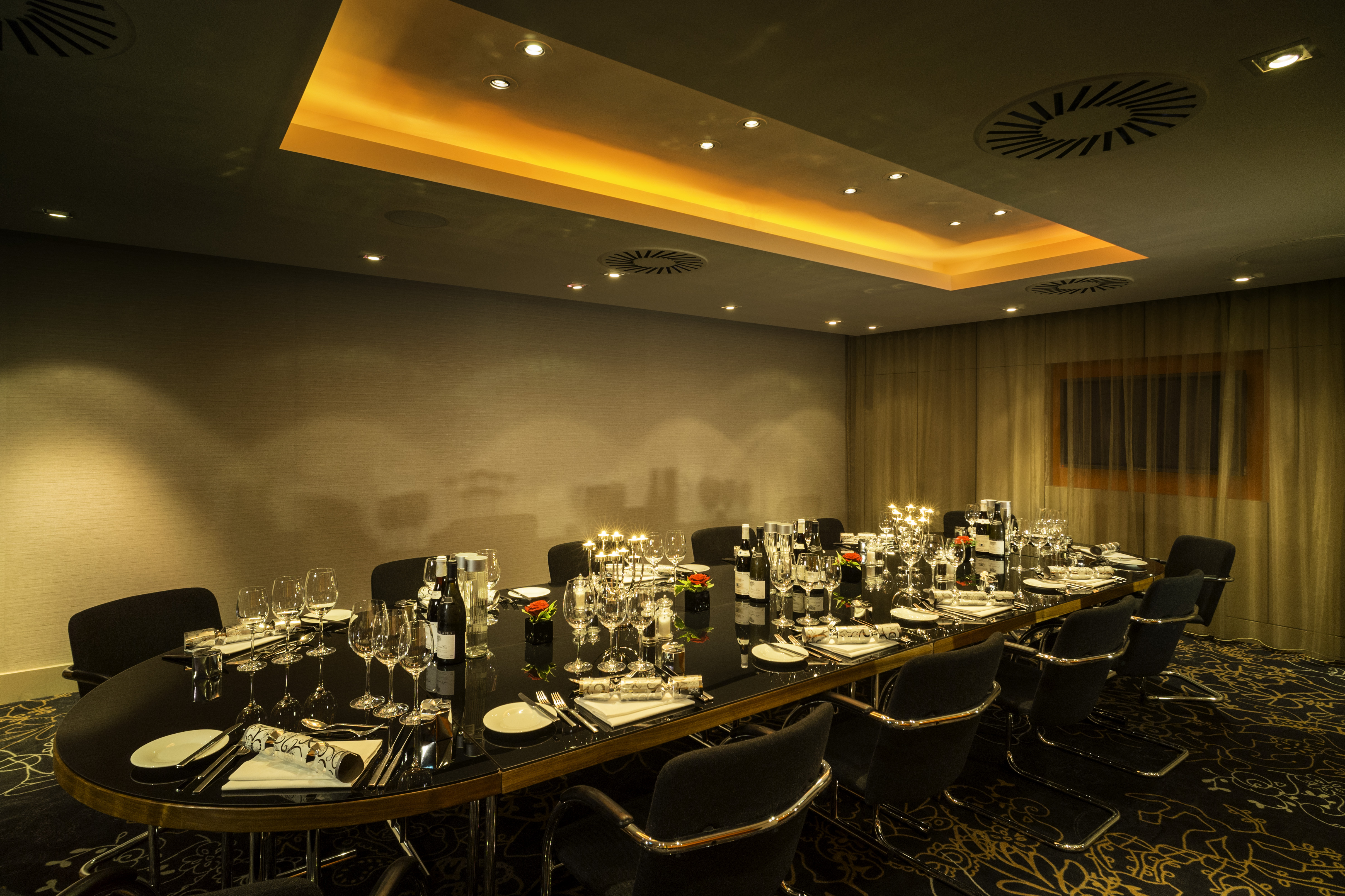 Elegant dining setup in Apex City of London Hotel for corporate events and gatherings.