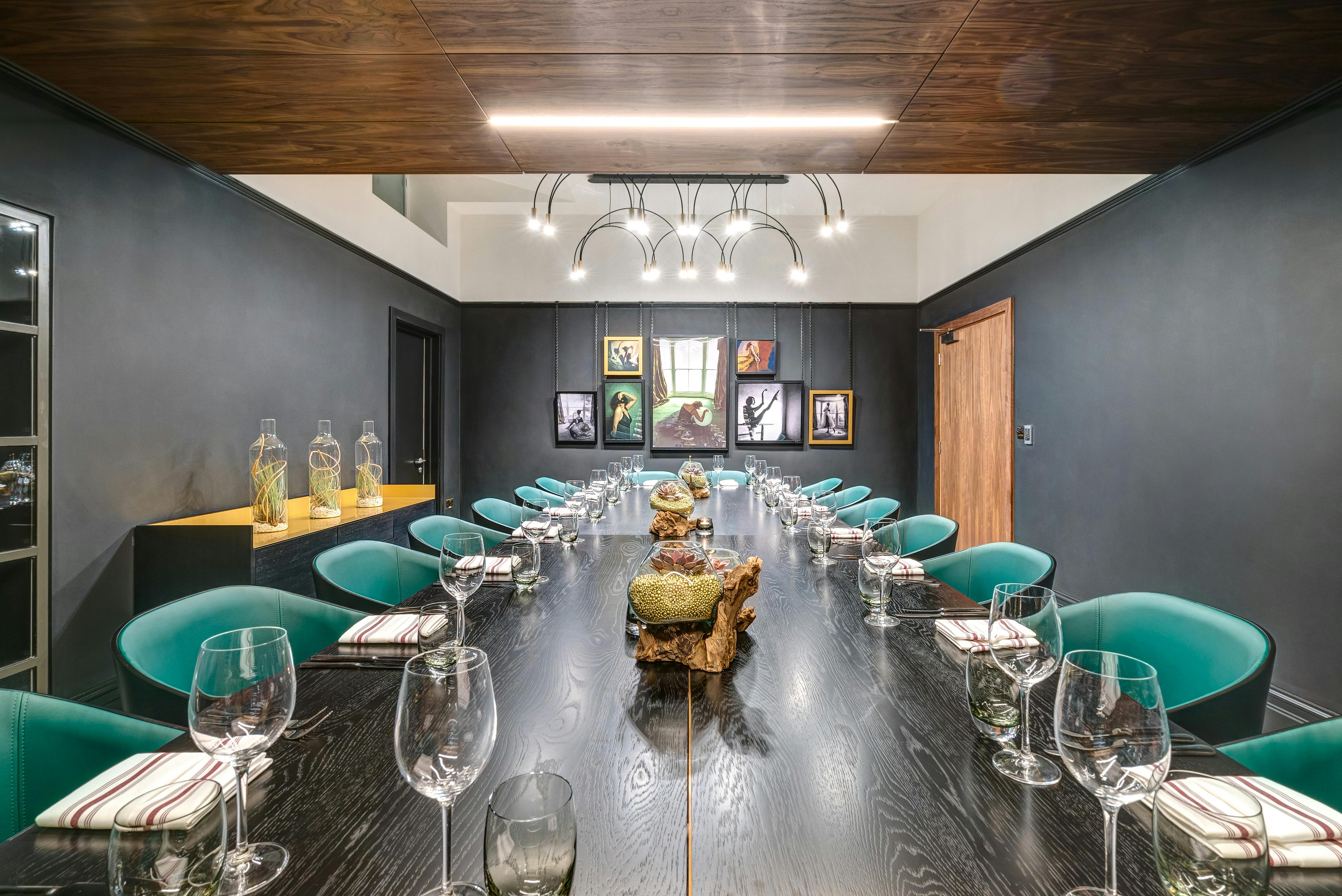 Justice Room at Apex Temple Court Hotel, elegant meeting space with dark wood table.