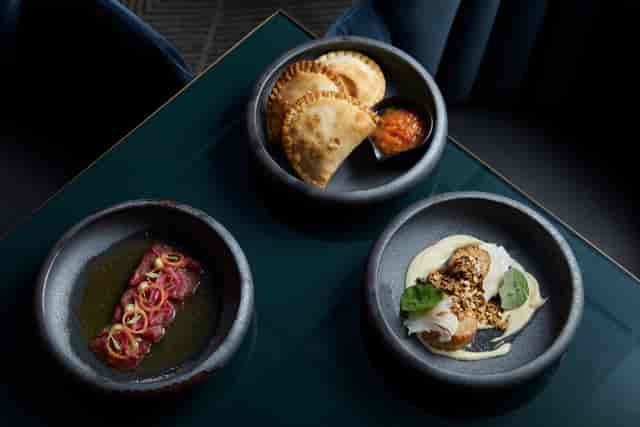 Semi-private dining room with gourmet dishes for upscale events at Gaucho Charlotte Street.