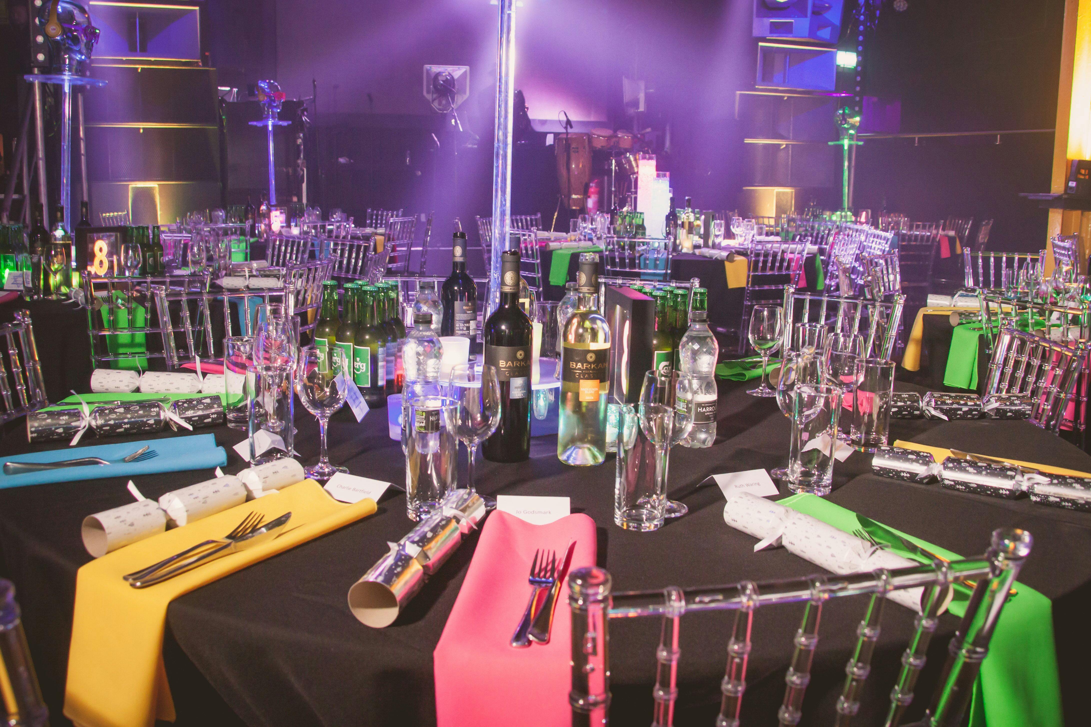 Vibrant event setup with elegant tables in Leeds Warehouse for celebrations or corporate events.