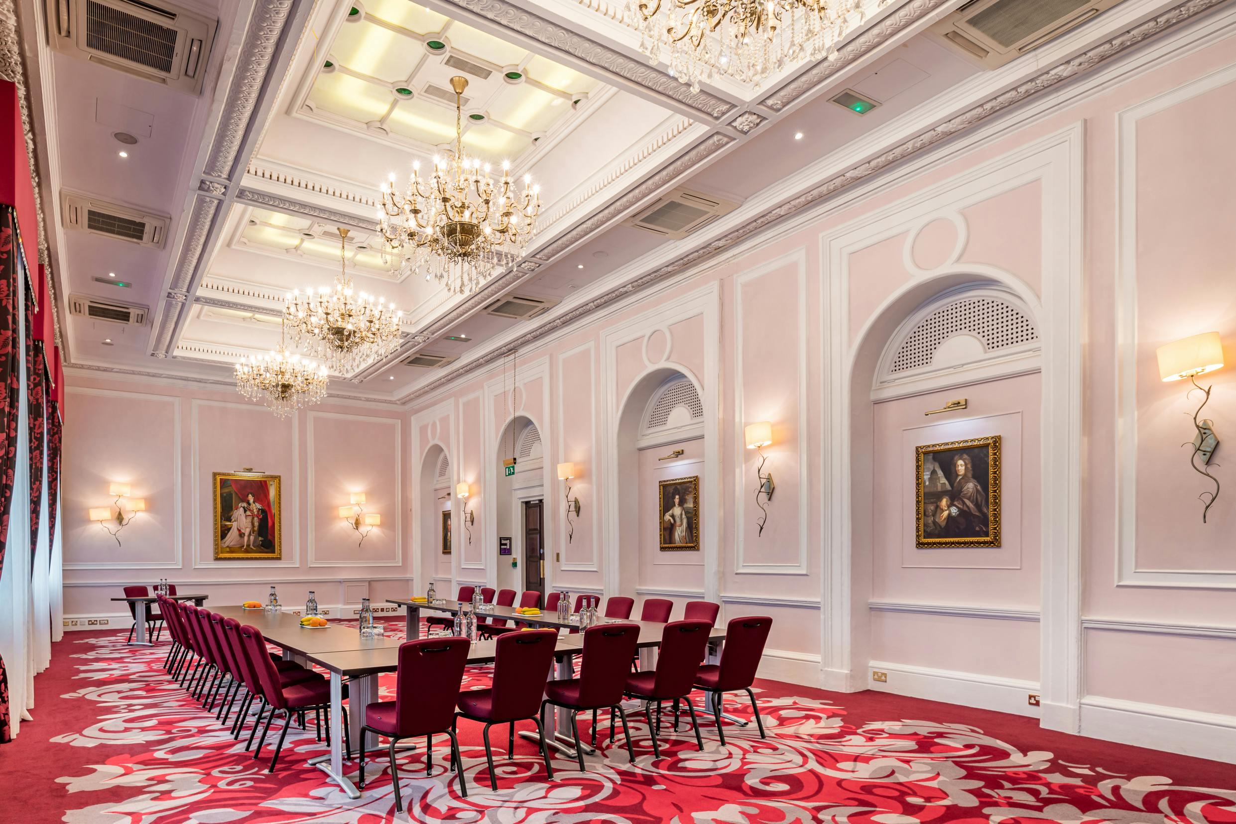 Sophisticated meeting room at The Clermont Charing Cross with elegant chandeliers for events.