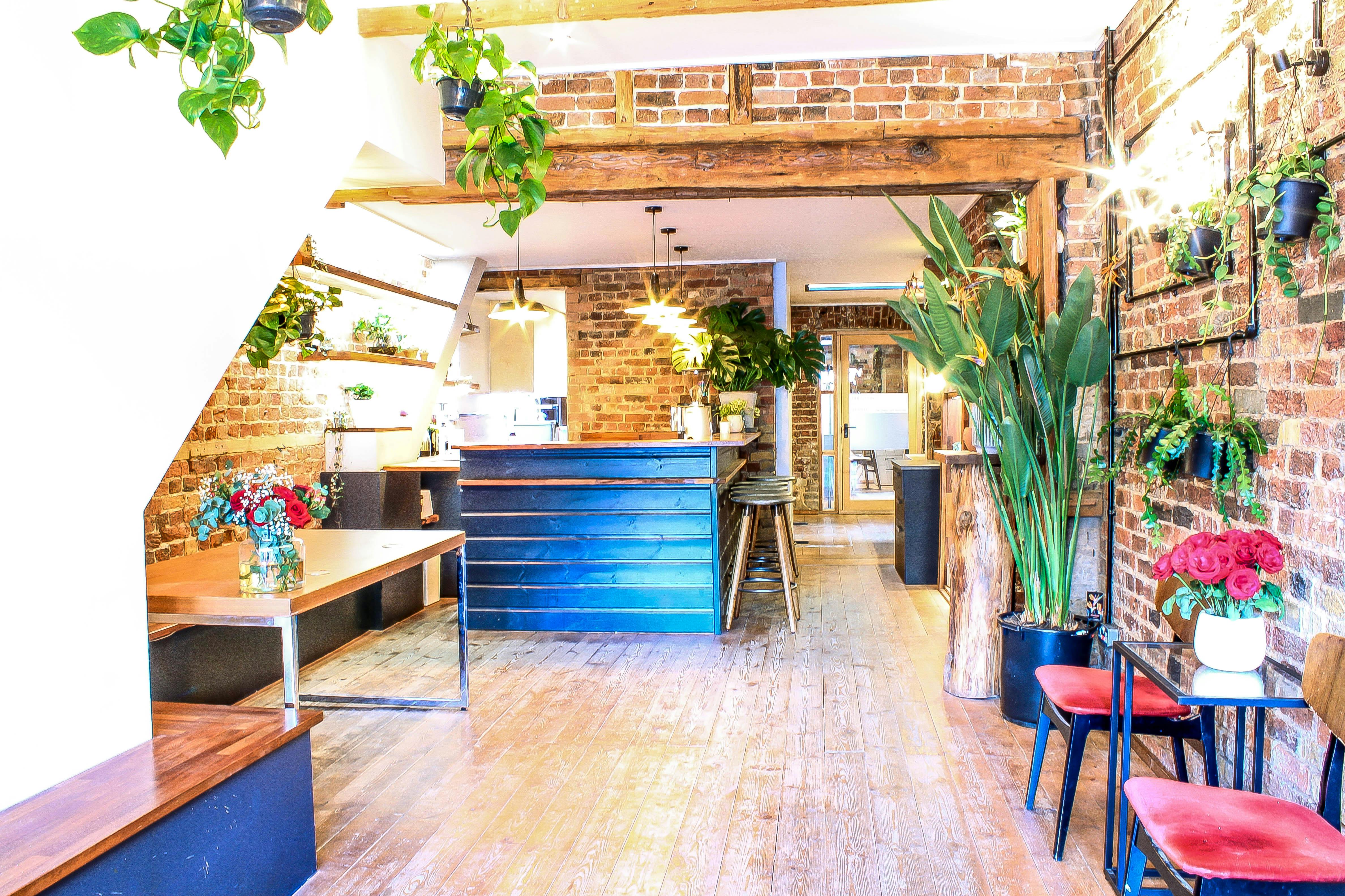 Stylish event space with exposed brick, ideal for networking events and workshops.
