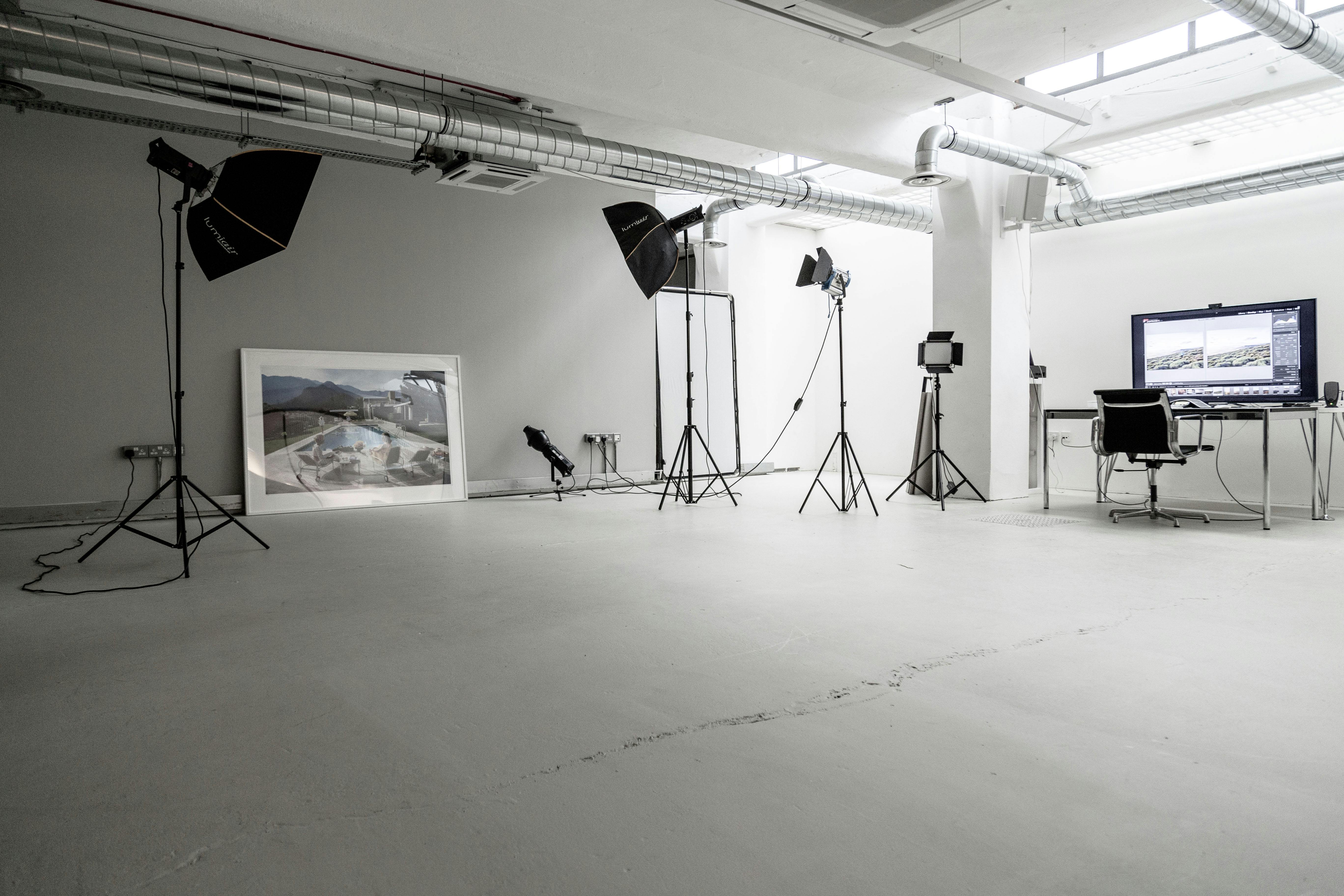 Versatile contemporary event space with professional lighting for workshops and product launches.