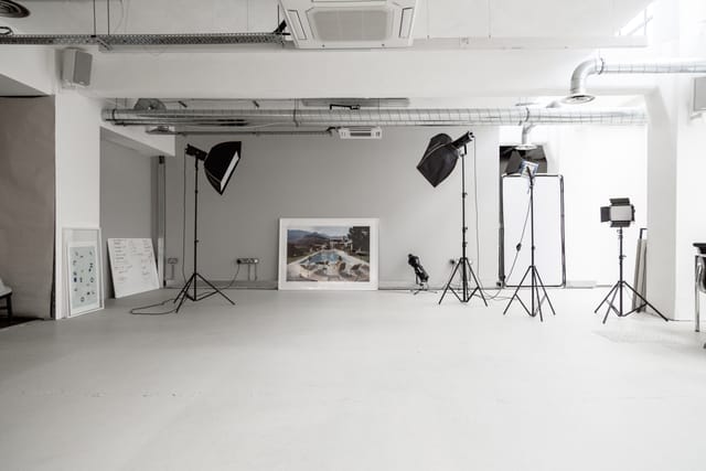Versatile contemporary event space with professional lighting for photo shoots and presentations.