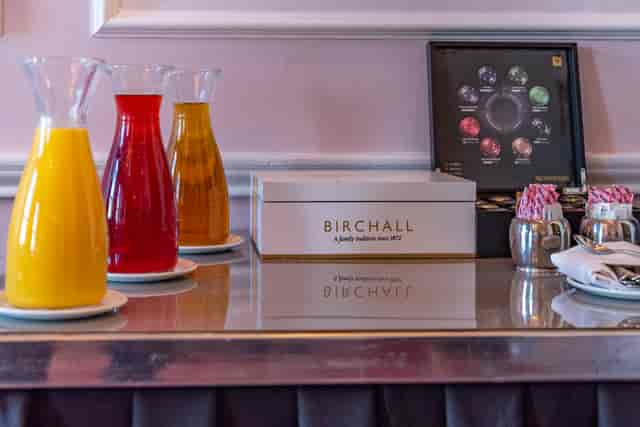 Refreshment station with vibrant juices and premium tea at The Clermont Charing Cross event.