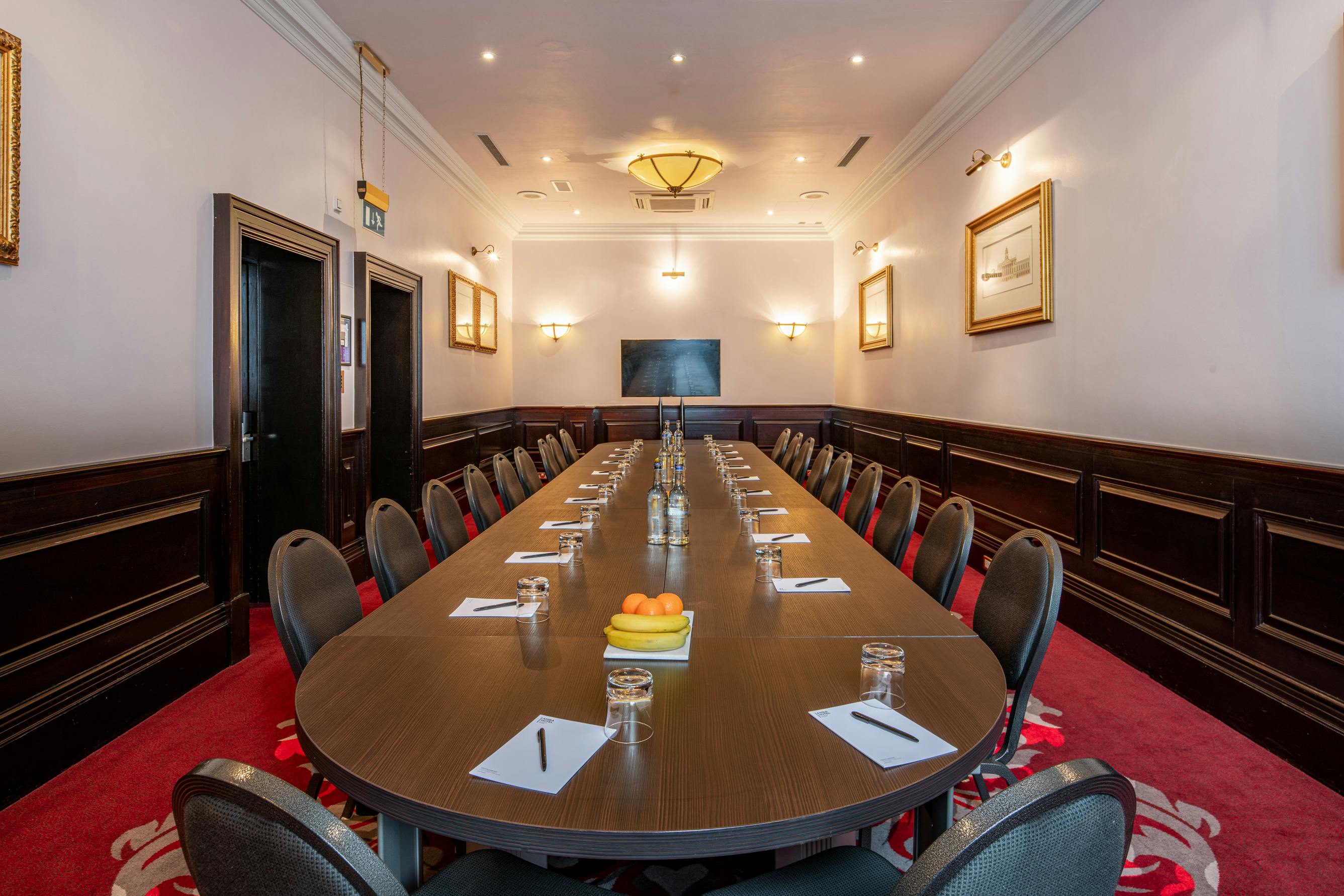 Boardroom at The Clermont Charing Cross, elegant table for professional meetings and events.