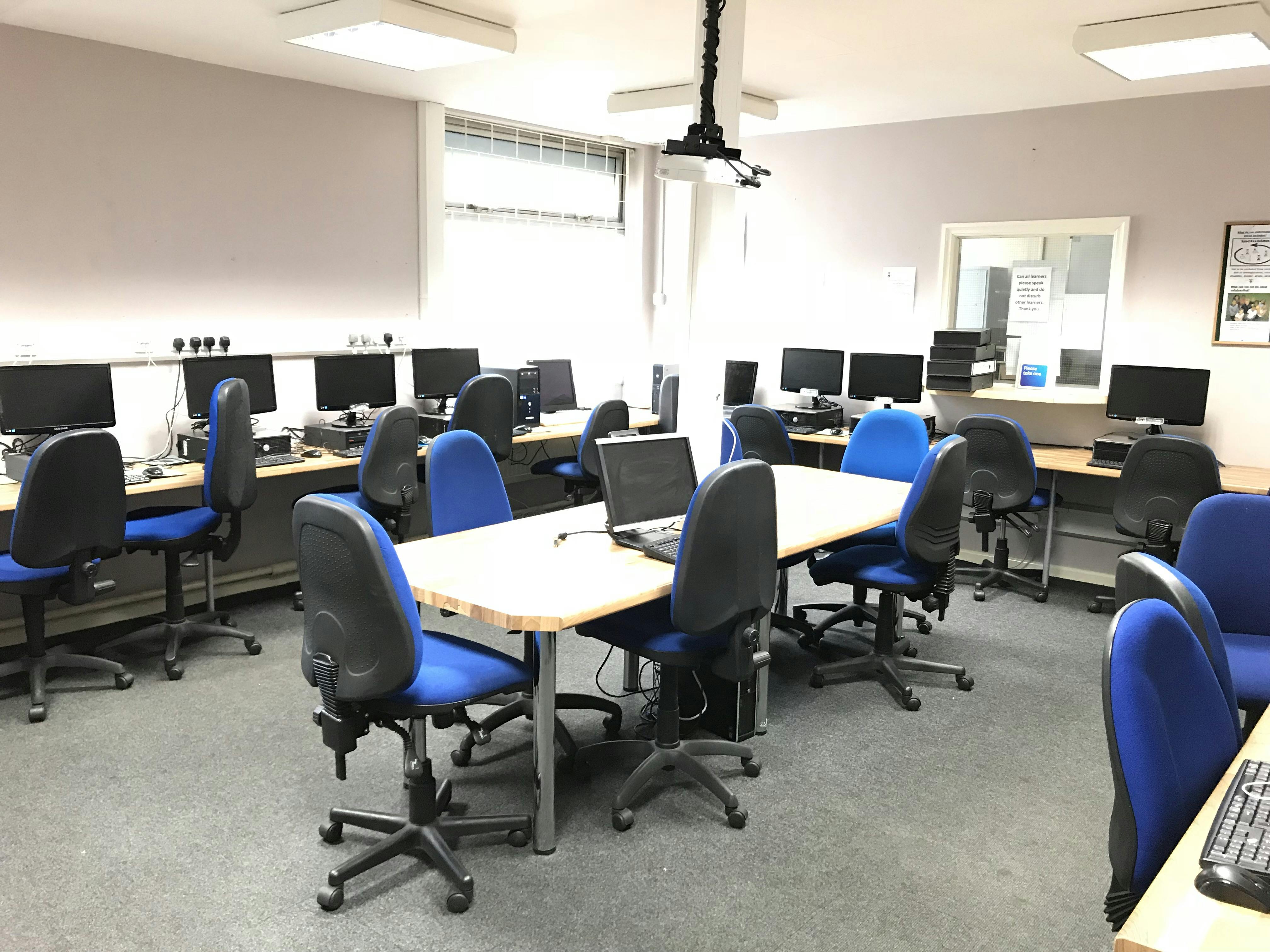 IT suite in ITC Centre with computers, ideal for tech workshops and meetings.