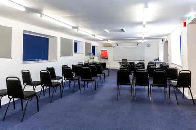William Kent meeting space with black chairs, ideal for workshops and presentations.