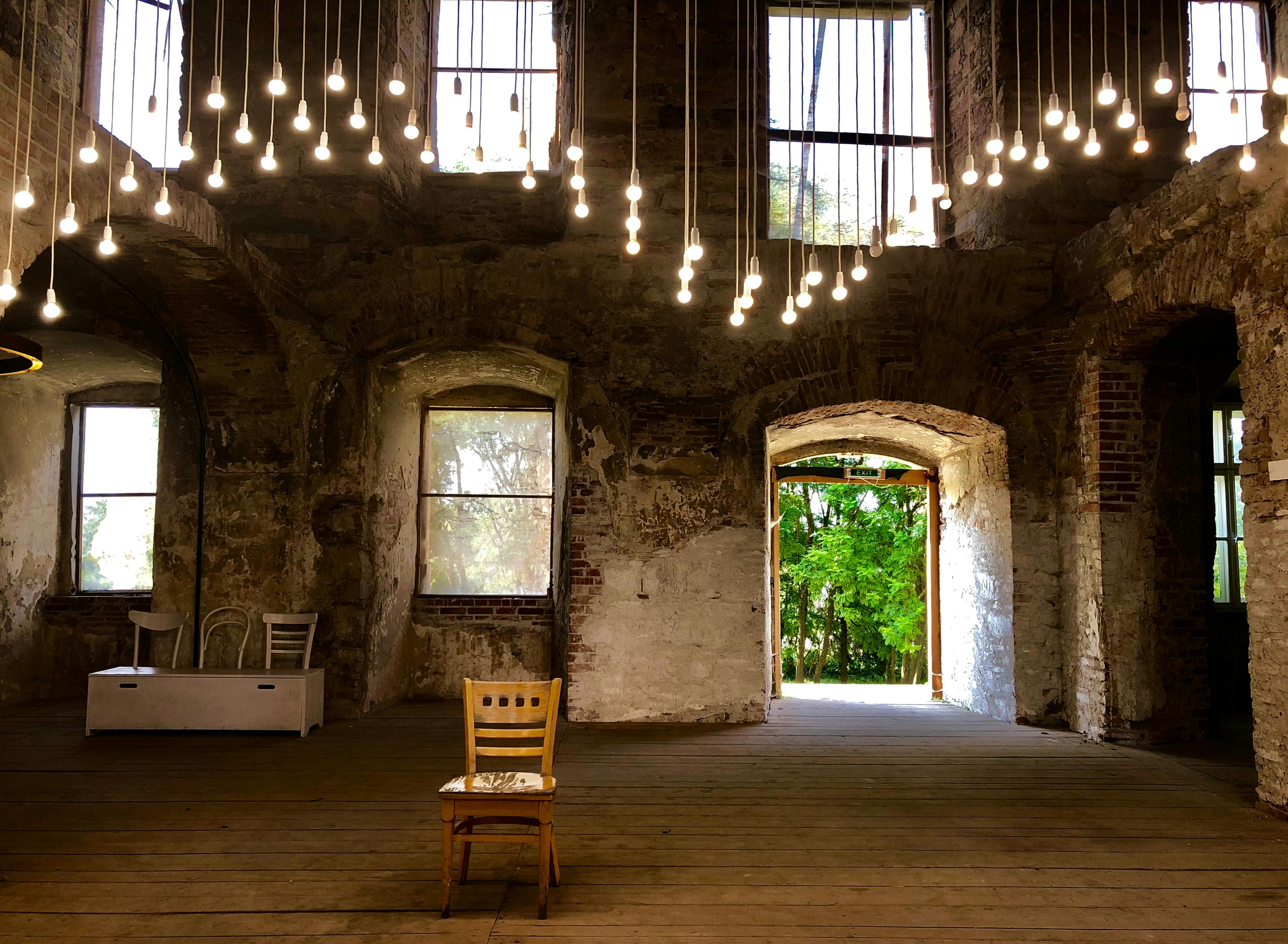 MiniRoom event space with exposed brick, perfect for gatherings and workshops.