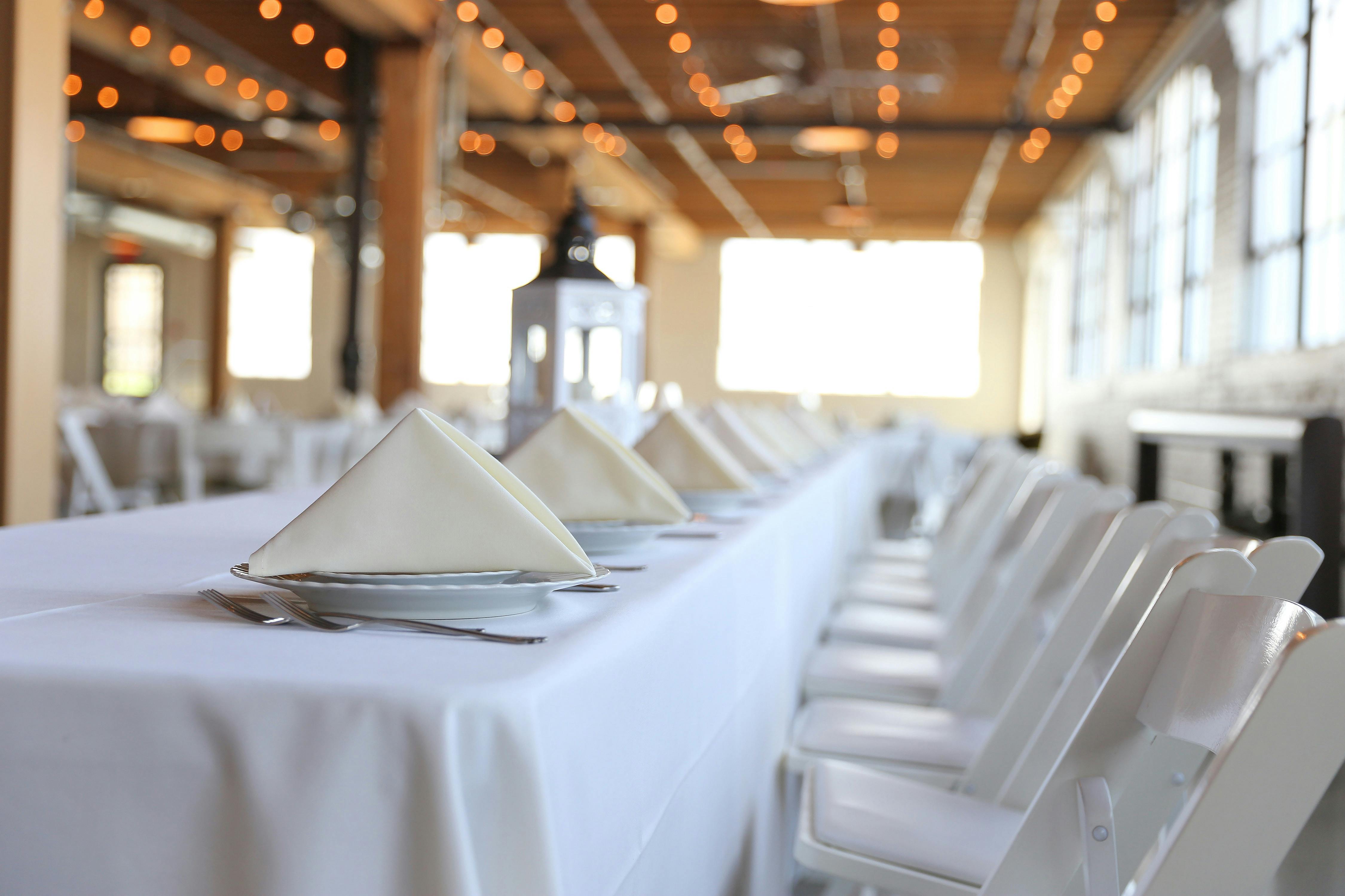 Elegant dining area with white tablecloth, perfect for gatherings and celebrations.