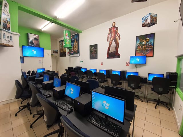 Tech-equipped training room with superhero decor for workshops and seminars.
