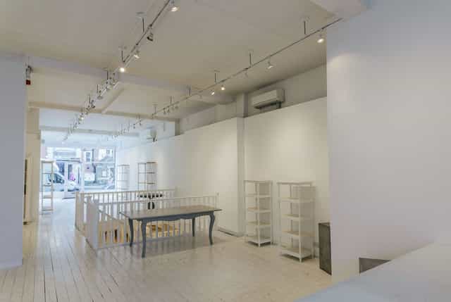 Modern event venue with ample natural light, perfect for workshops and networking.