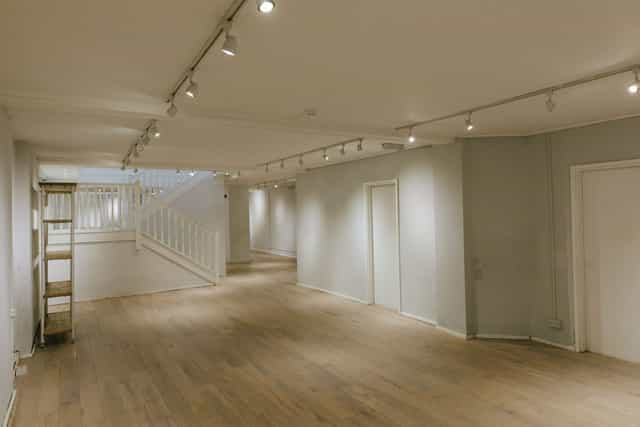 Spacious event venue with wooden flooring for gatherings and workshops at 725 Fulham Road.