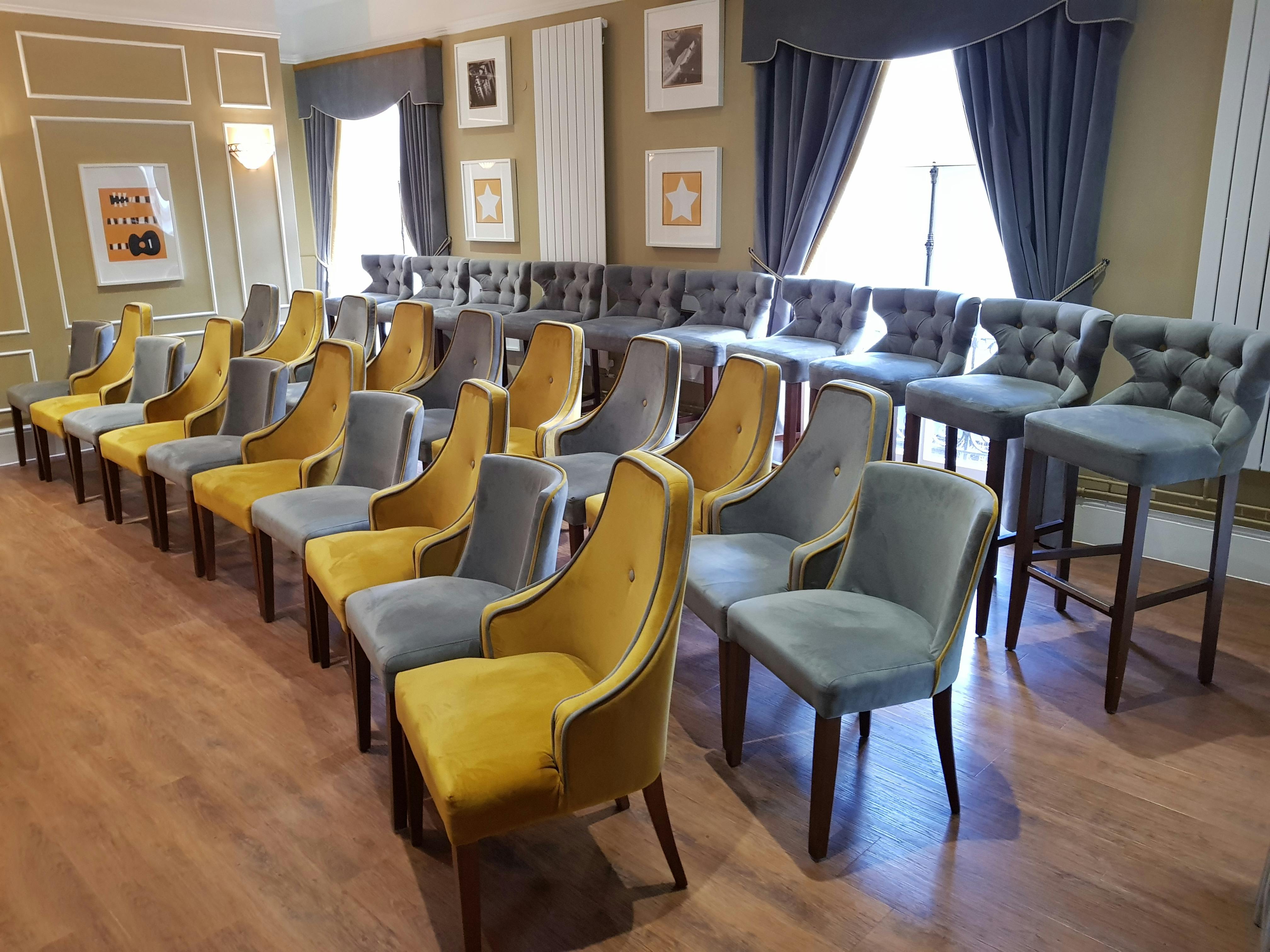 Spotlight Lounge at Wolverhampton Grand Theatre, stylish meeting space with vibrant decor.