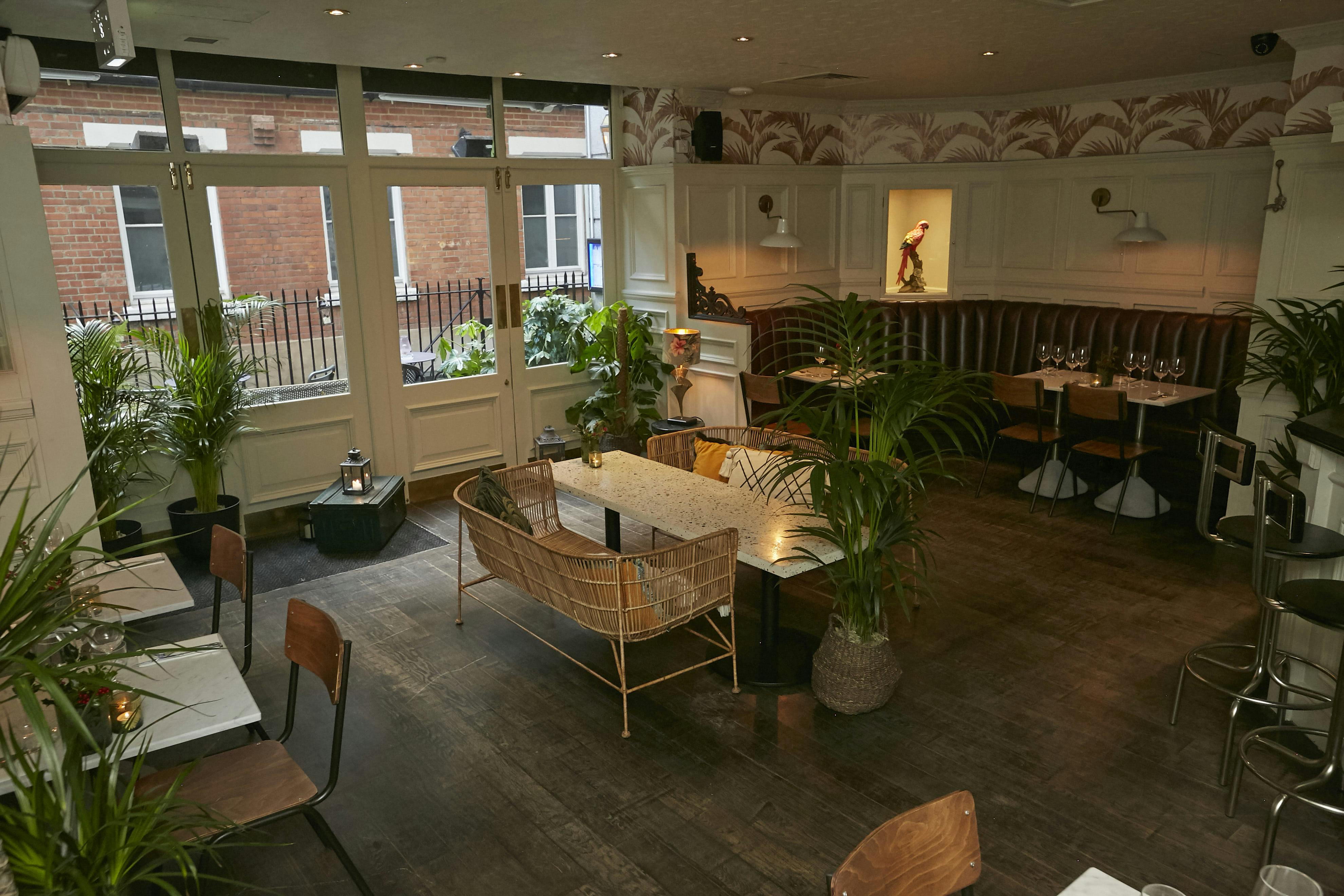 Ground Floor Bar and Restaurant event space with natural light, ideal for networking and dinners.