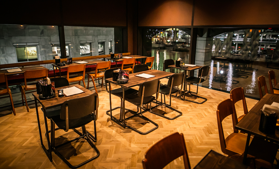 Stylish dining space at Upstairs Lounge, perfect for networking events and gatherings.
