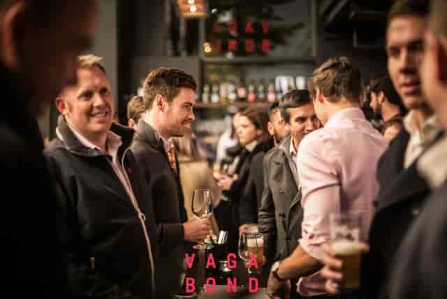 Vibrant networking event at Upstairs Lounge, modern decor perfect for corporate gatherings.