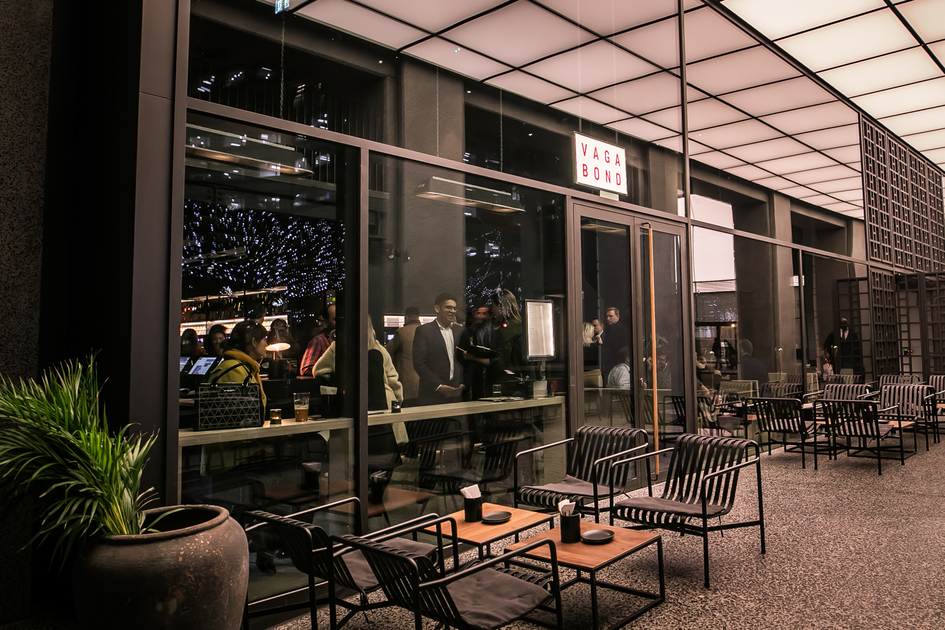 Sleek venue with glass windows at Vagabond Canary Wharf, ideal for networking events.