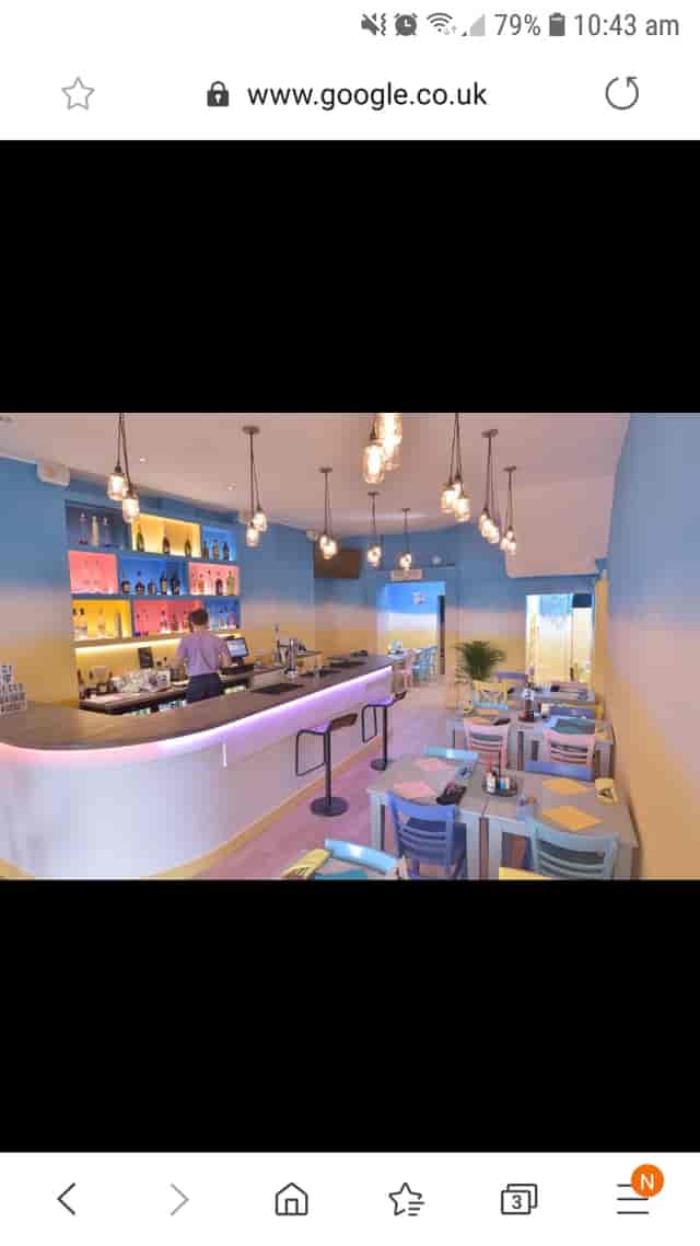 Vibrant modern café venue with colorful decor for casual meetings and events.