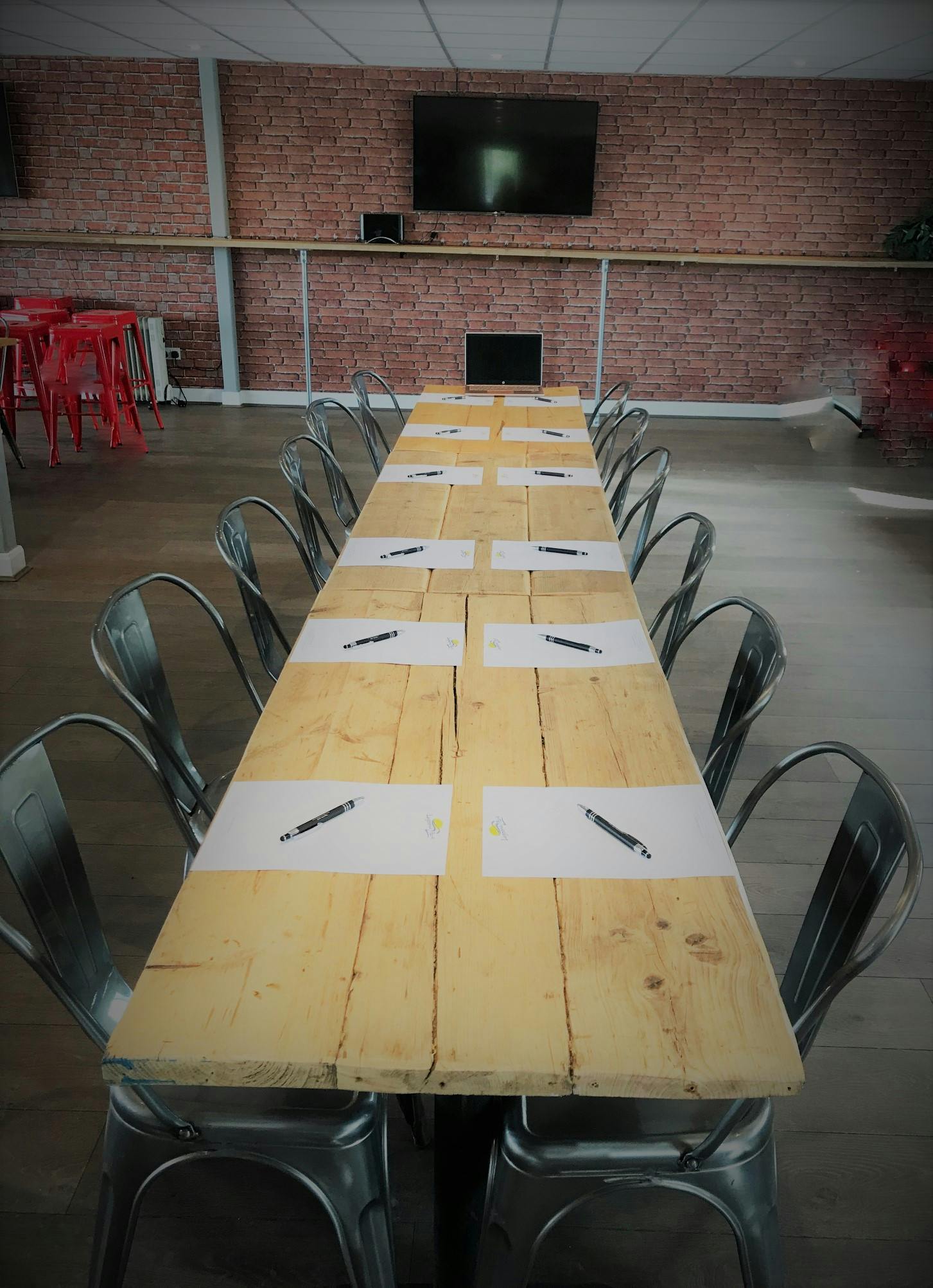 Rustic wooden meeting table at Lagoona Bar & Grill, perfect for collaboration events.