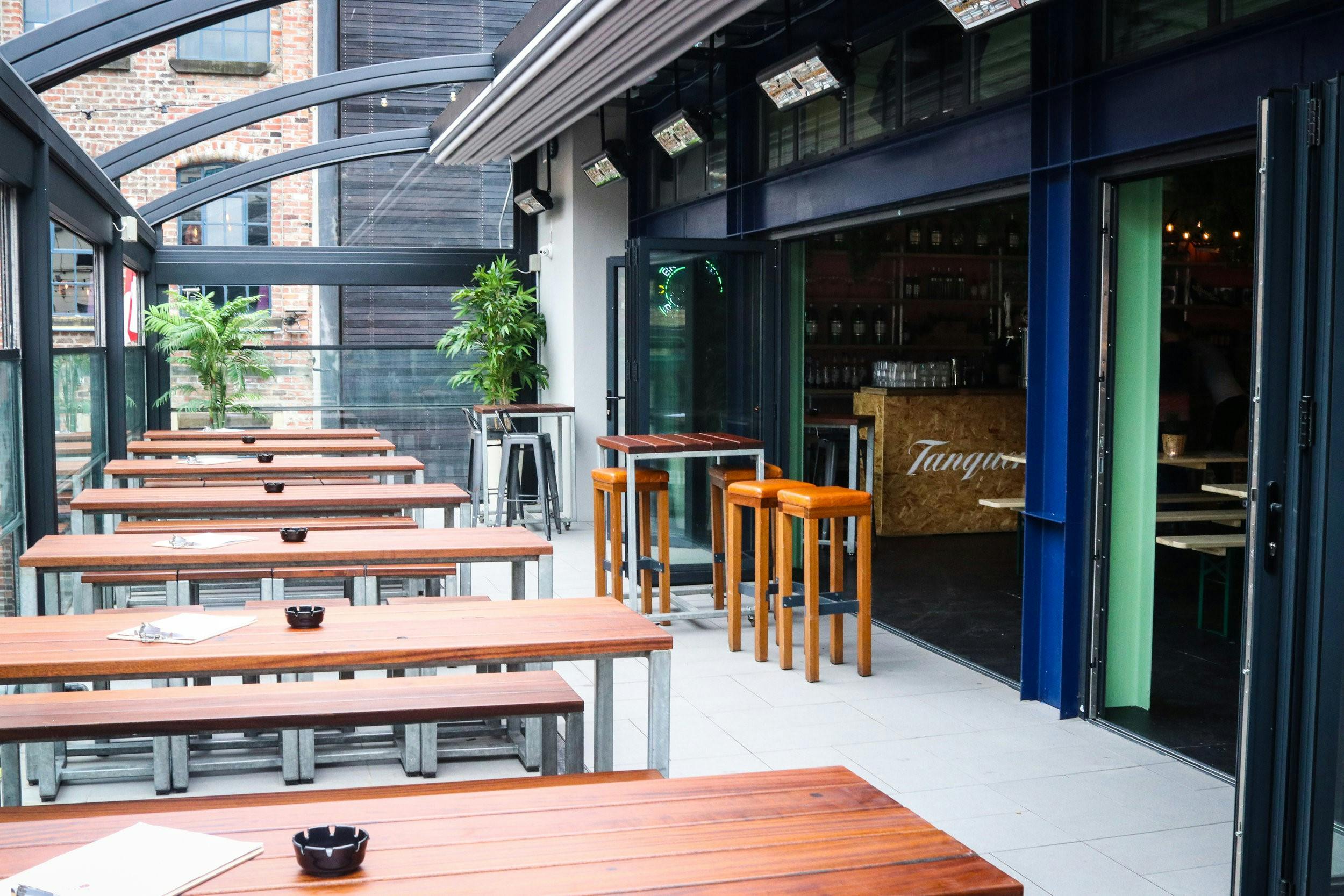 Top floor Cocktail Garden in Modo, open-air event space with wooden seating for gatherings.