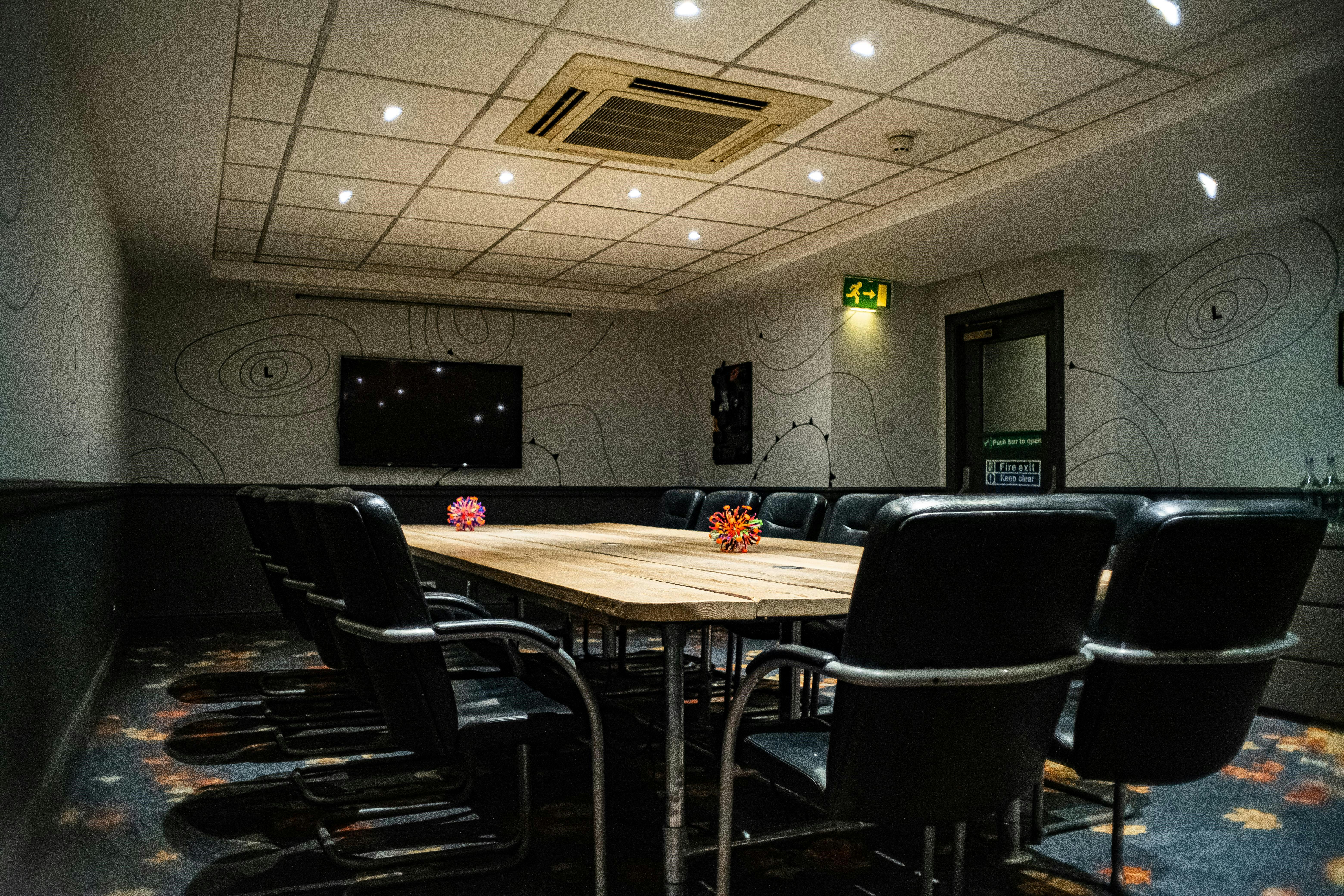 Manchester Boardroom at Ibis Styles, spacious table for meetings and presentations.