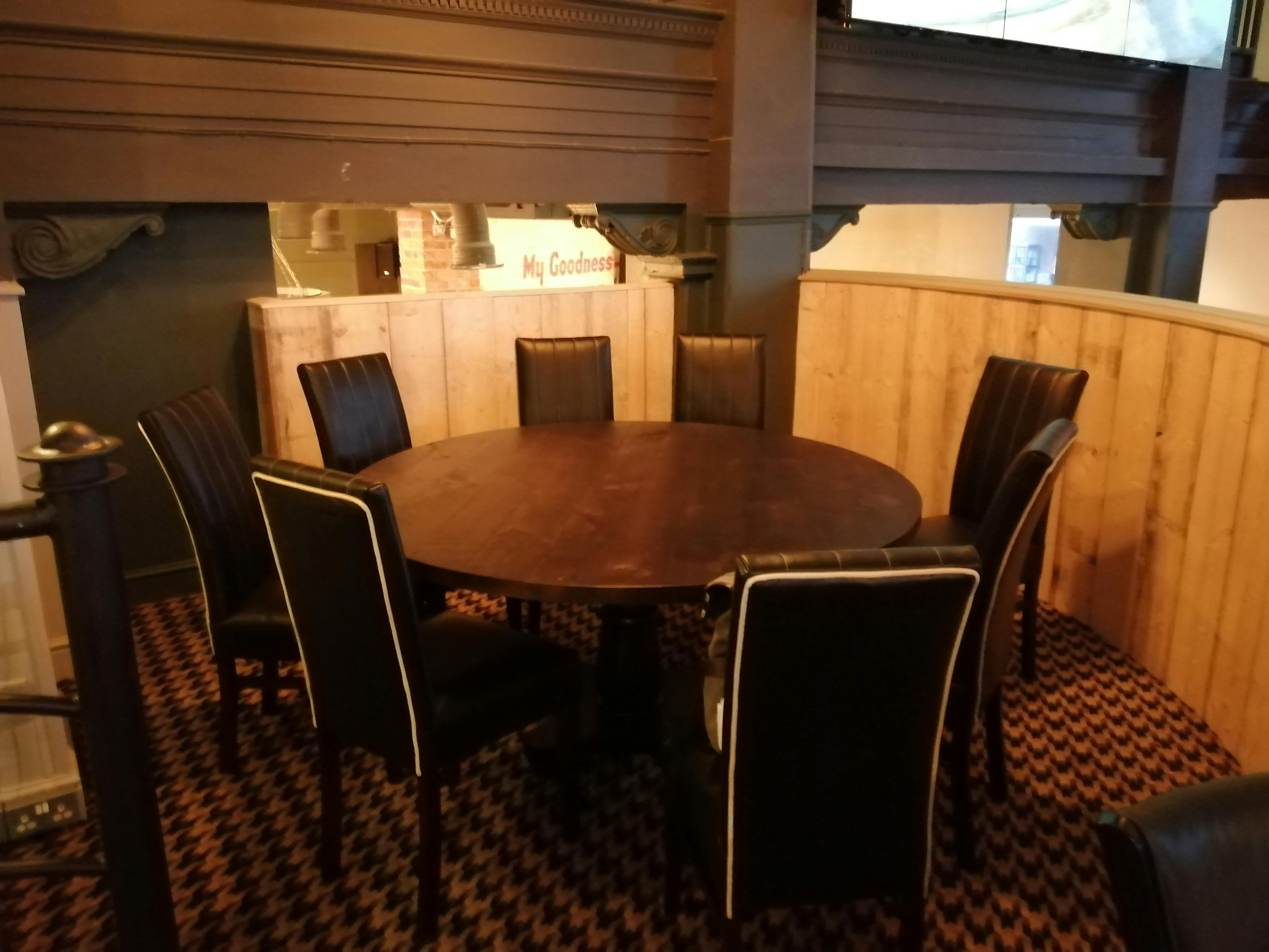 Function Room in O'Neill's Leeds with round table, ideal for meetings and brainstorming.