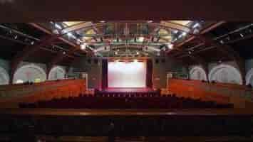 Versatile event space in The Tabernacle, featuring proscenium stage and tiered seating.