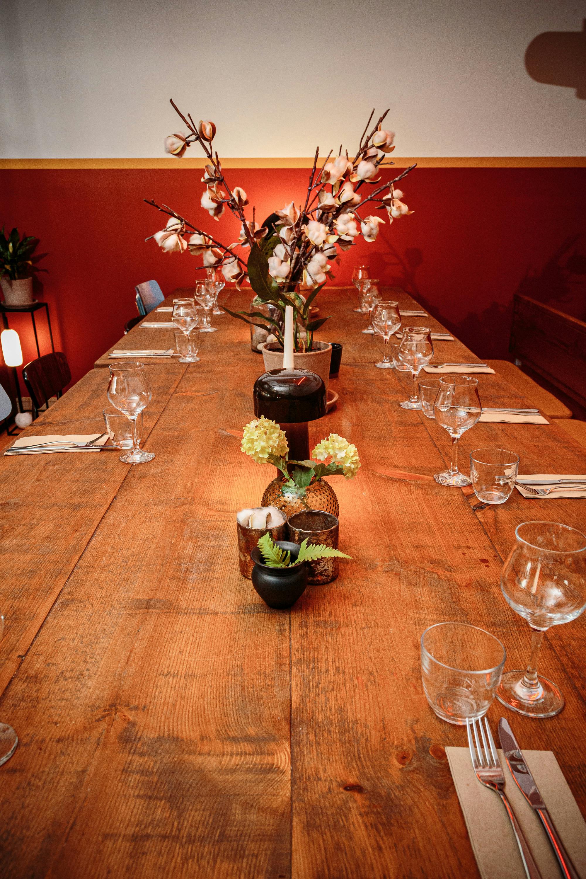 Private dining room with rustic table setting for intimate gatherings and networking events.