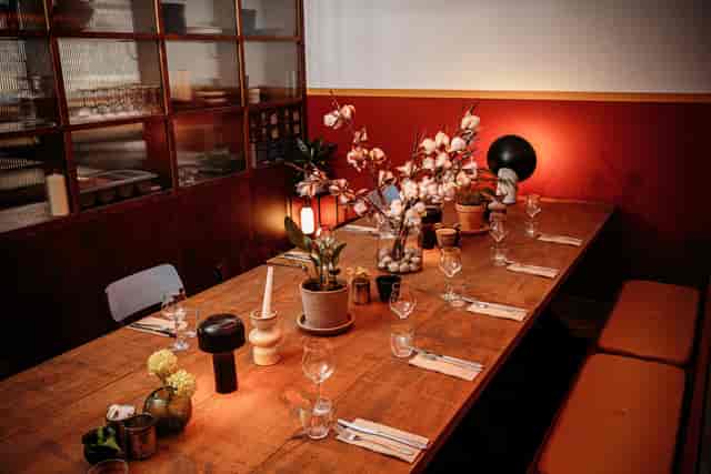 Private dining room with elegant table setup for corporate meetings and private events.