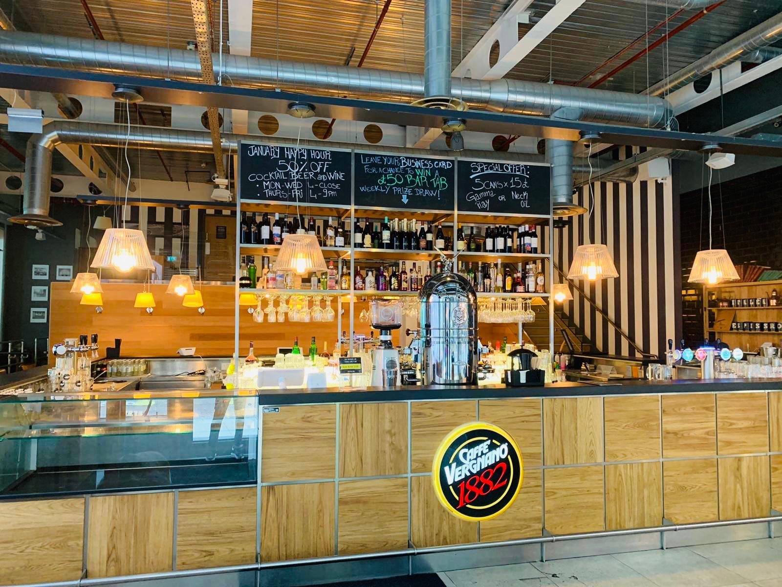Modern bar setup at Whole Venue, 1882 Mark Lane, ideal for networking events and casual meetings. - Banner