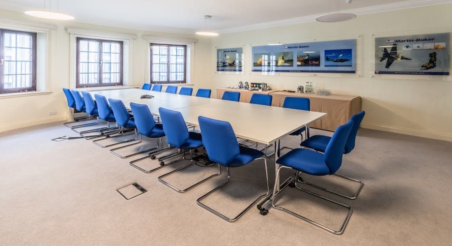 Modern conference room with ergonomic chairs for strategic planning sessions.