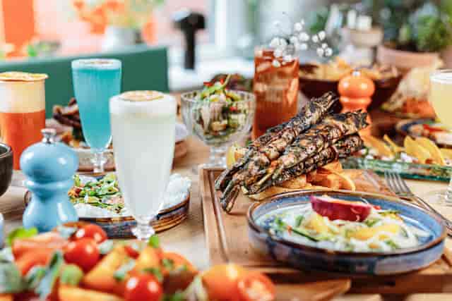 Vibrant food spread with cocktails for networking events at The Cotton Factory.
