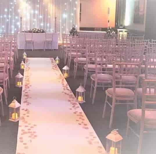 Elegant event space at Holiday Inn Guildford with floral aisle runner for weddings.