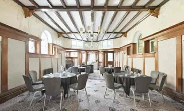 Ballroom at Richmond Hill Hotel with elegant wood paneling, ideal for meetings and events.