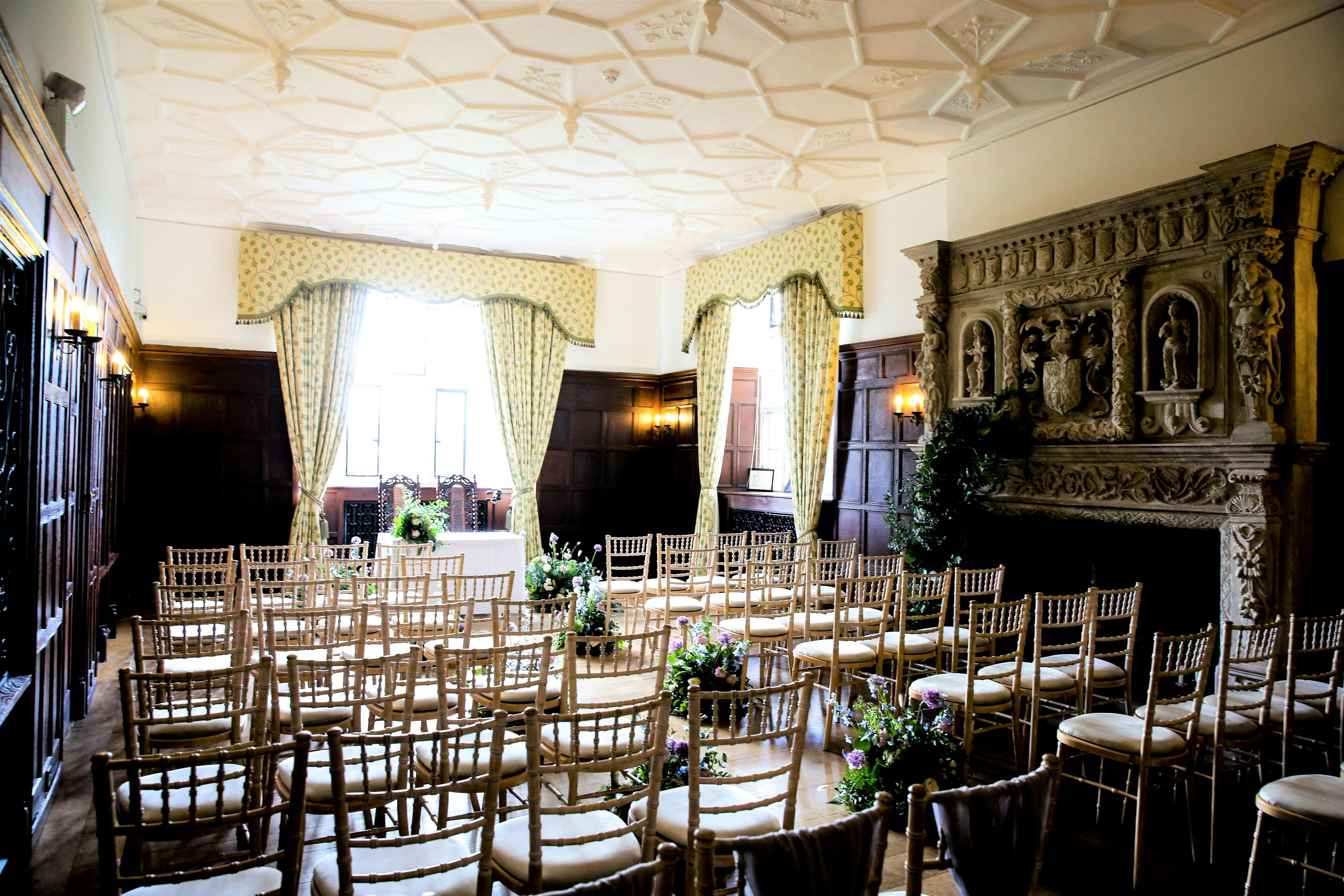 Elegant event space at Wakehurst Library with ornate ceilings, ideal for weddings and gatherings.