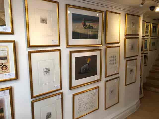 Art gallery wall with framed artworks, perfect for art-themed events and workshops.