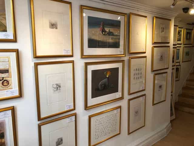 Art gallery wall with framed artworks, perfect for art-themed events and workshops.
