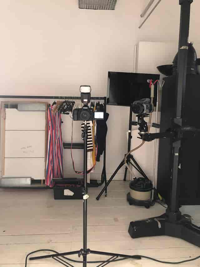 Photography studio setup with cameras and lighting for event production.