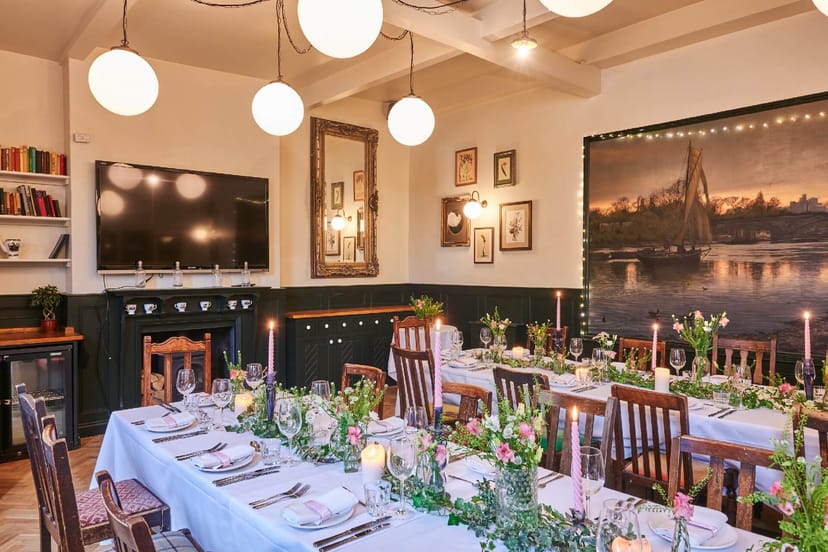 Semi-private dining room at The Pilot with floral decor for boutique events and meetings.