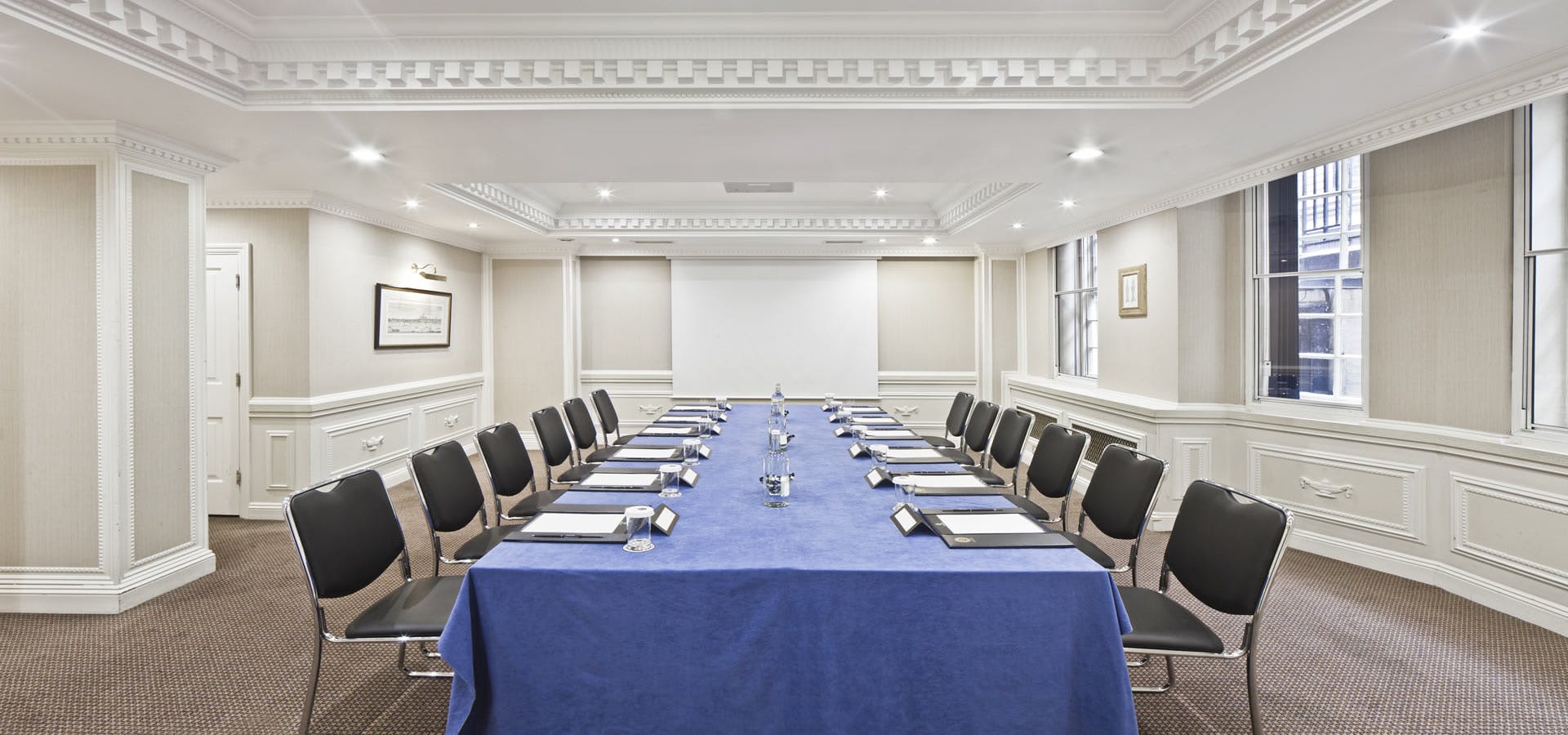 Cavendish Suite meeting room with blue tablecloth, ideal for professional events.