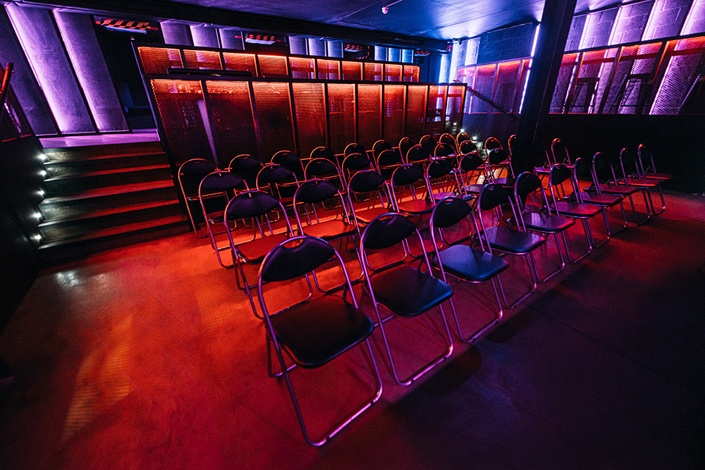 Modern event space with metallic chairs for presentations in Peckham Audio. - Banner