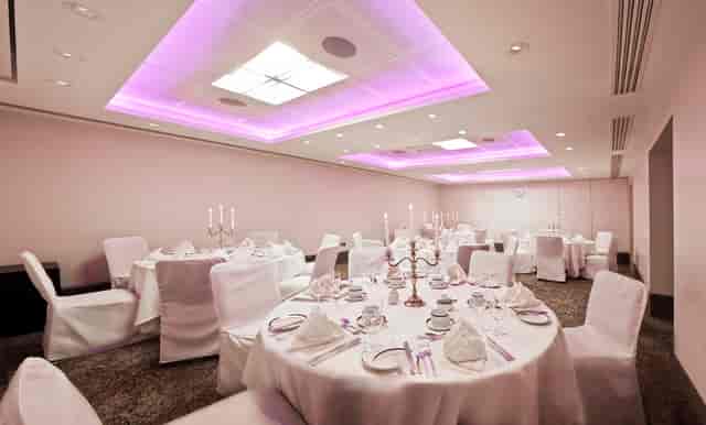 Elegant Langham Suite banquet room with soft purple lighting for upscale events.
